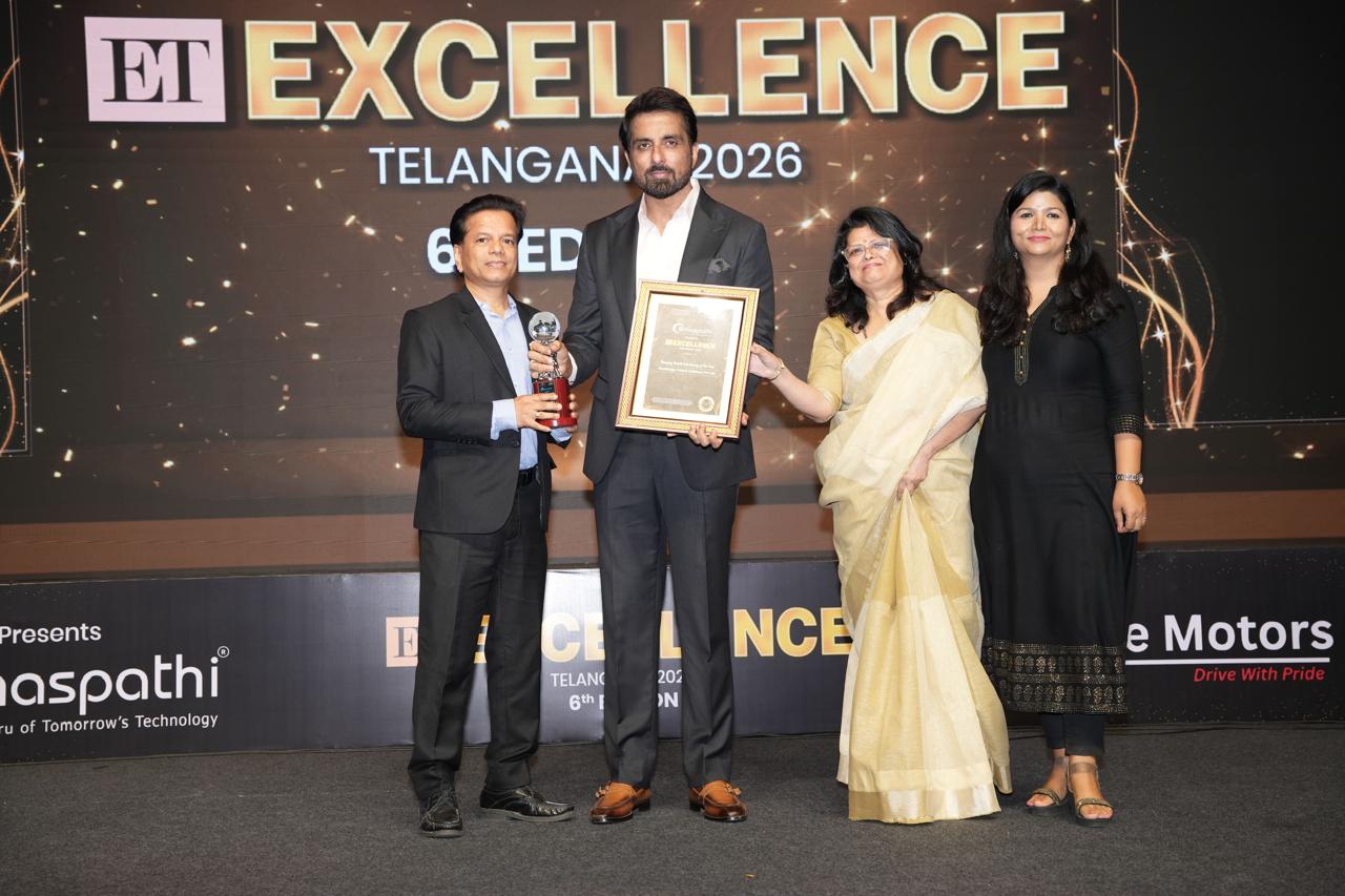 Ram Tulluri of WealthUpp receiving the ET Excellence Telangana 2026 award from actor Sonu Sood on stage, with the WealthUpp team