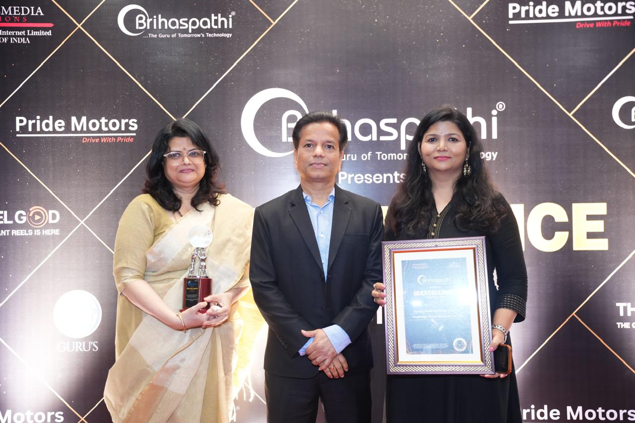 WealthUpp team members with the award trophy and framed citation at the ceremony backdrop